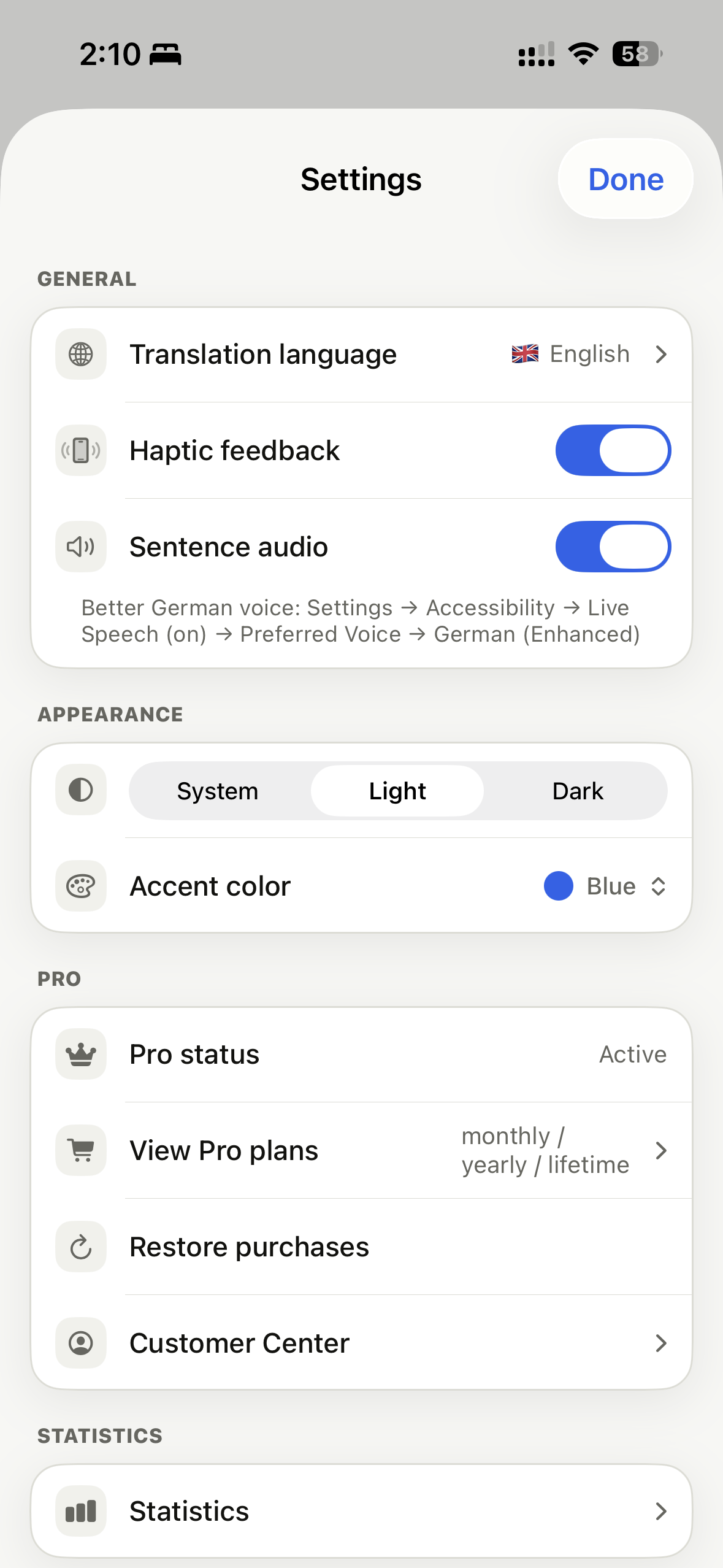 Original Fluent settings screen with translation language, haptics, audio, theme, accent color, and Pro options.